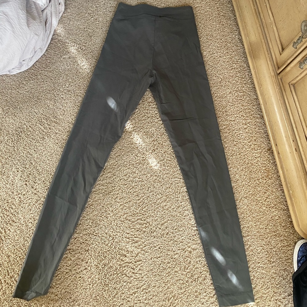 Dark green ladies stretch pants .